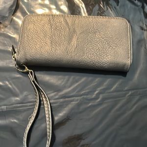 New sliver wallet with small mark near the zipper